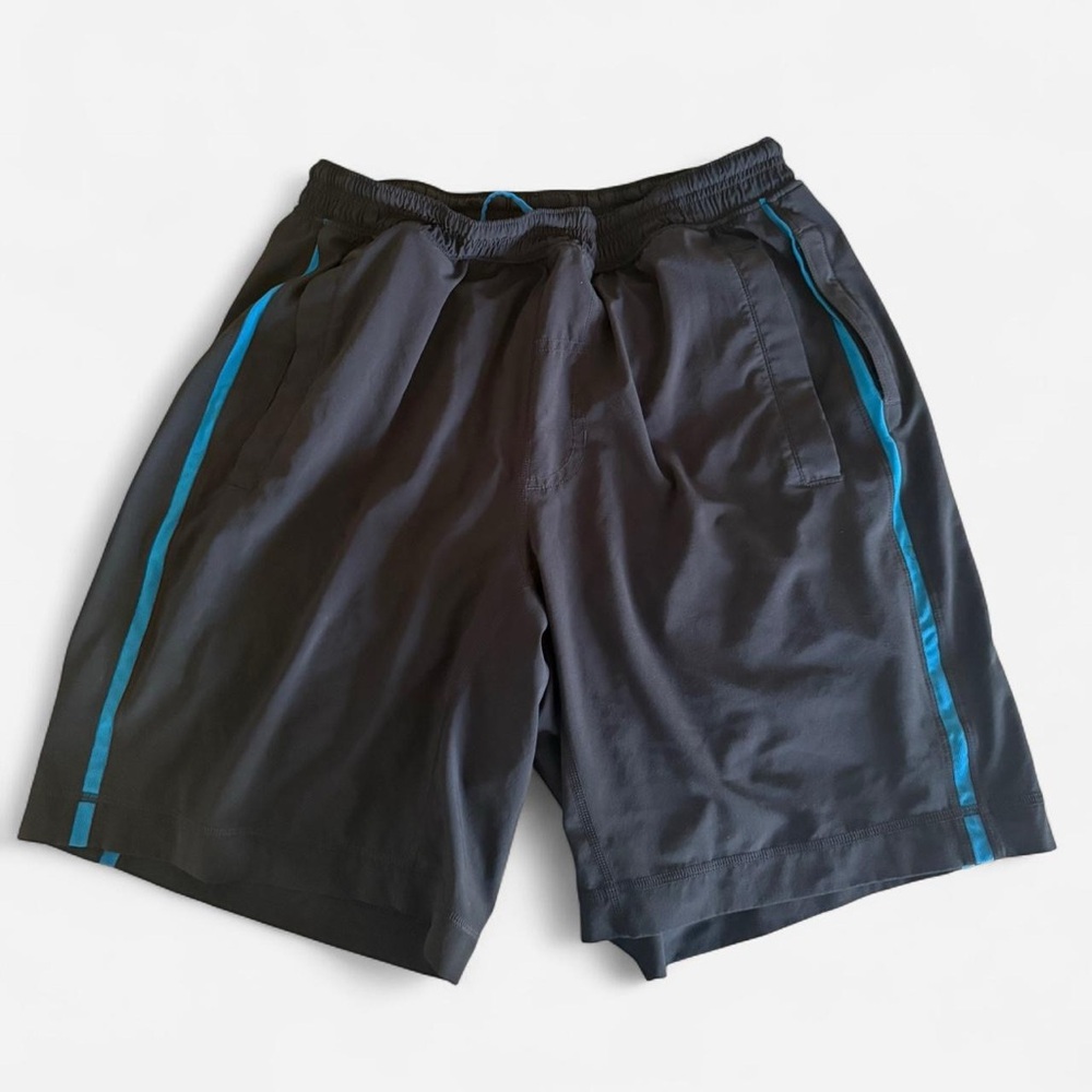 Lululemon Pace Breaker with liner black shorts with blue stripes